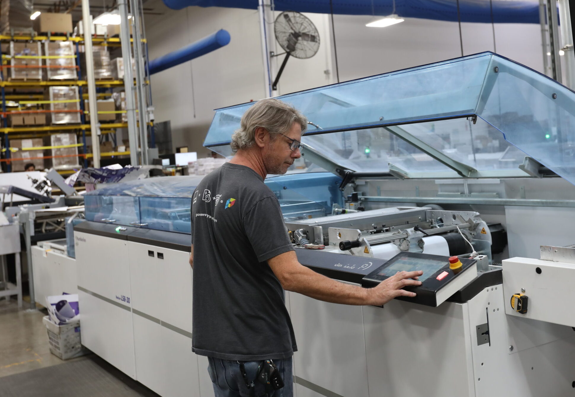 Male worker at press machine