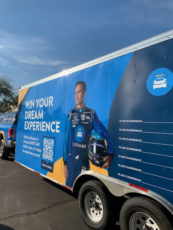 Large trailer with wrapped graphic of a man