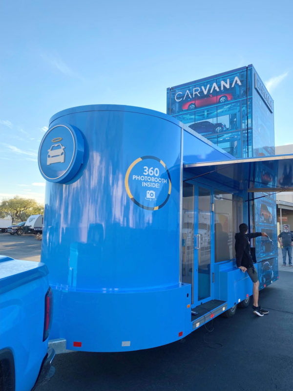 Large photobooth trailer wrapped to look like Carvana building