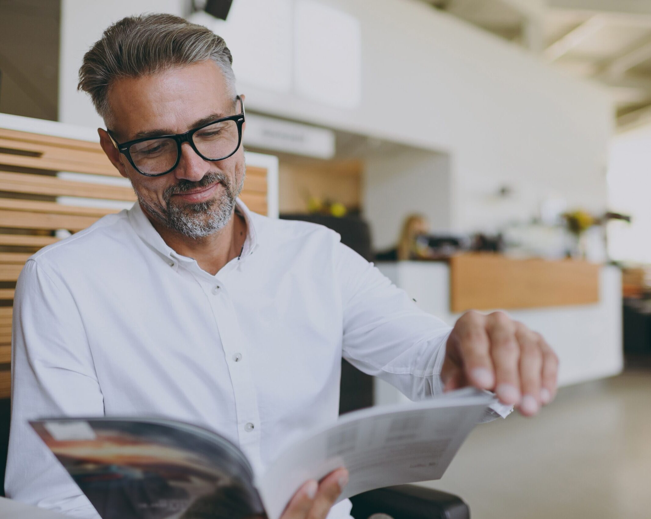 Businessman reads catalogue