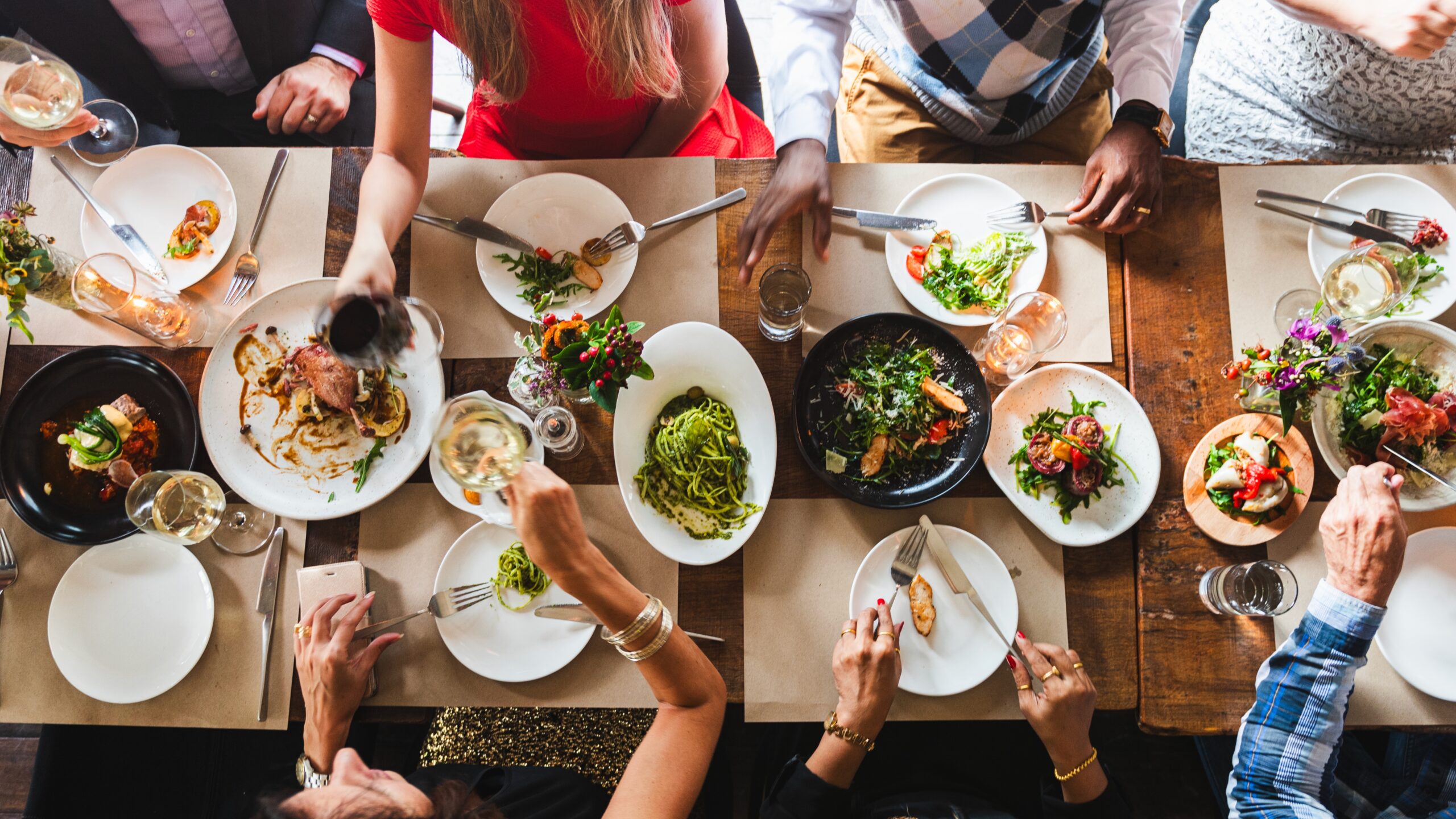 Top view of people eating food over table