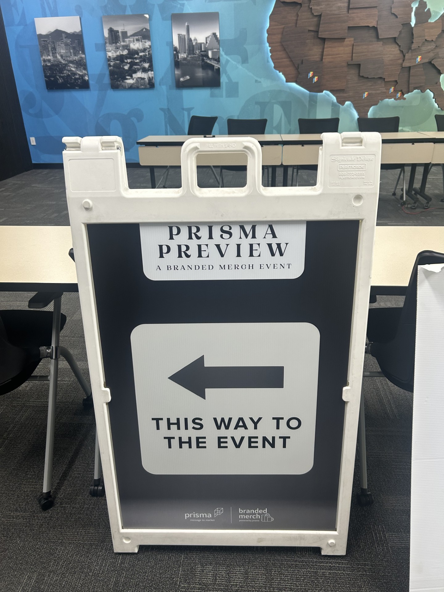 A-frame directional sign for the "Prisma Preview" branded merch event.