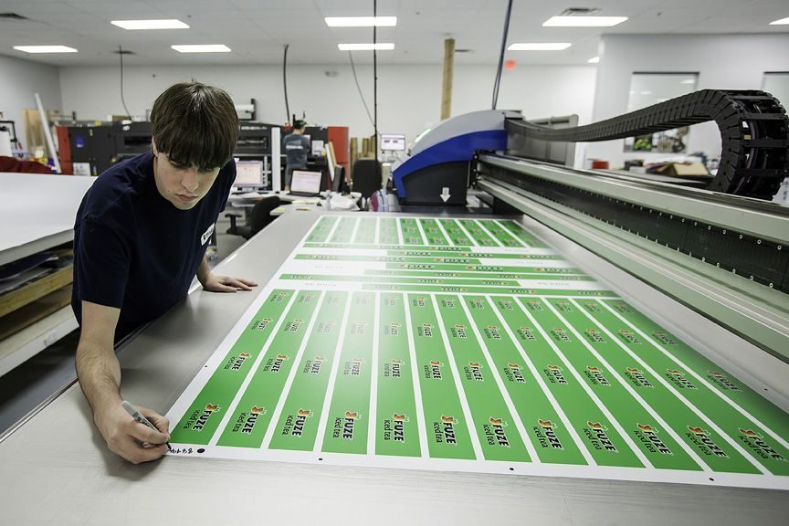 Man operating printing machine