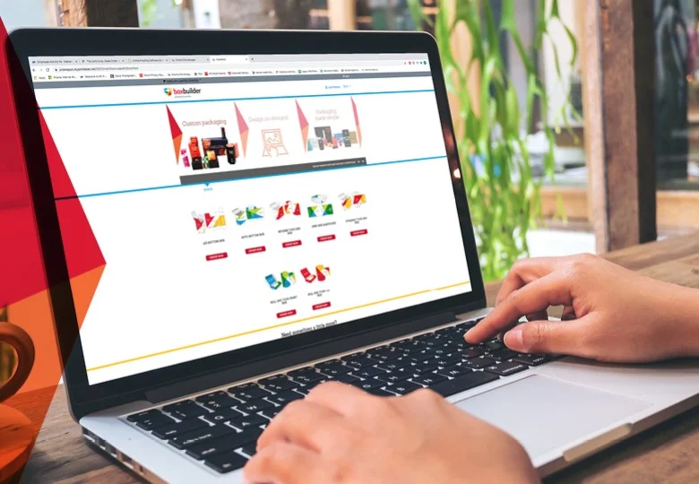 Person using the BoxBuilder online packaging design tool on a laptop.