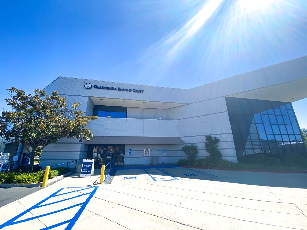 Exterior of a California Bank & Trust branch building under a sunny sky.