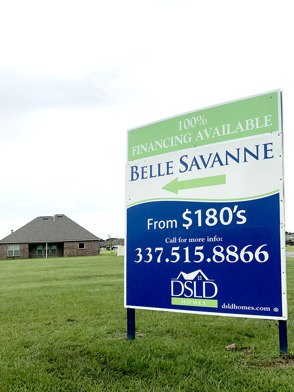 DSLD Homes yard sign advertising the Belle Savanne community with pricing and financing details.