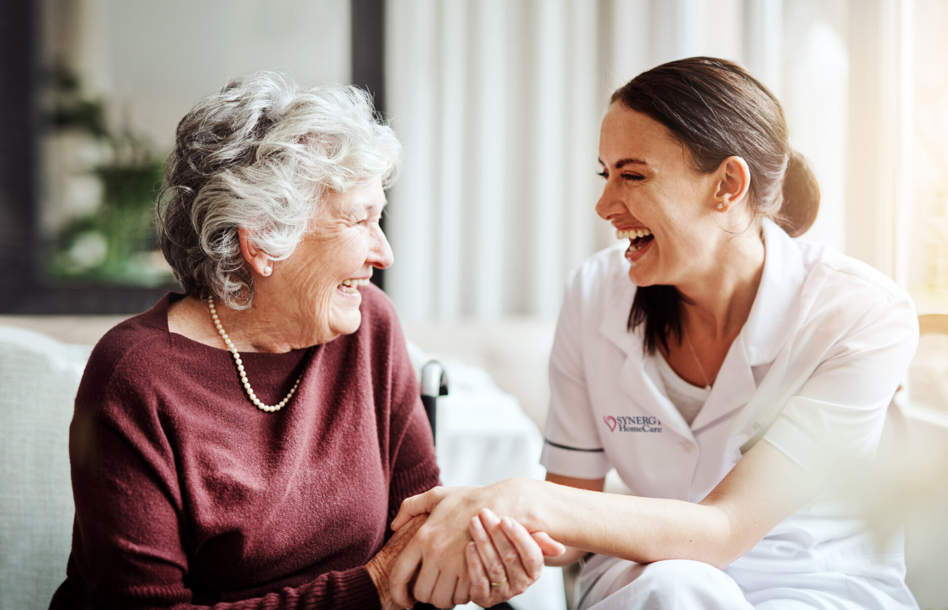 Doctor caring for elderly woman
