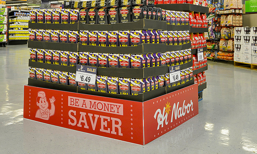 Hi Nabor supermarket end-cap display branded "Be a Money Saver" with stacked product cases.