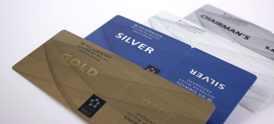 Gold, Silver, and Chairman's Preferred US Airways membership cards fanned out.