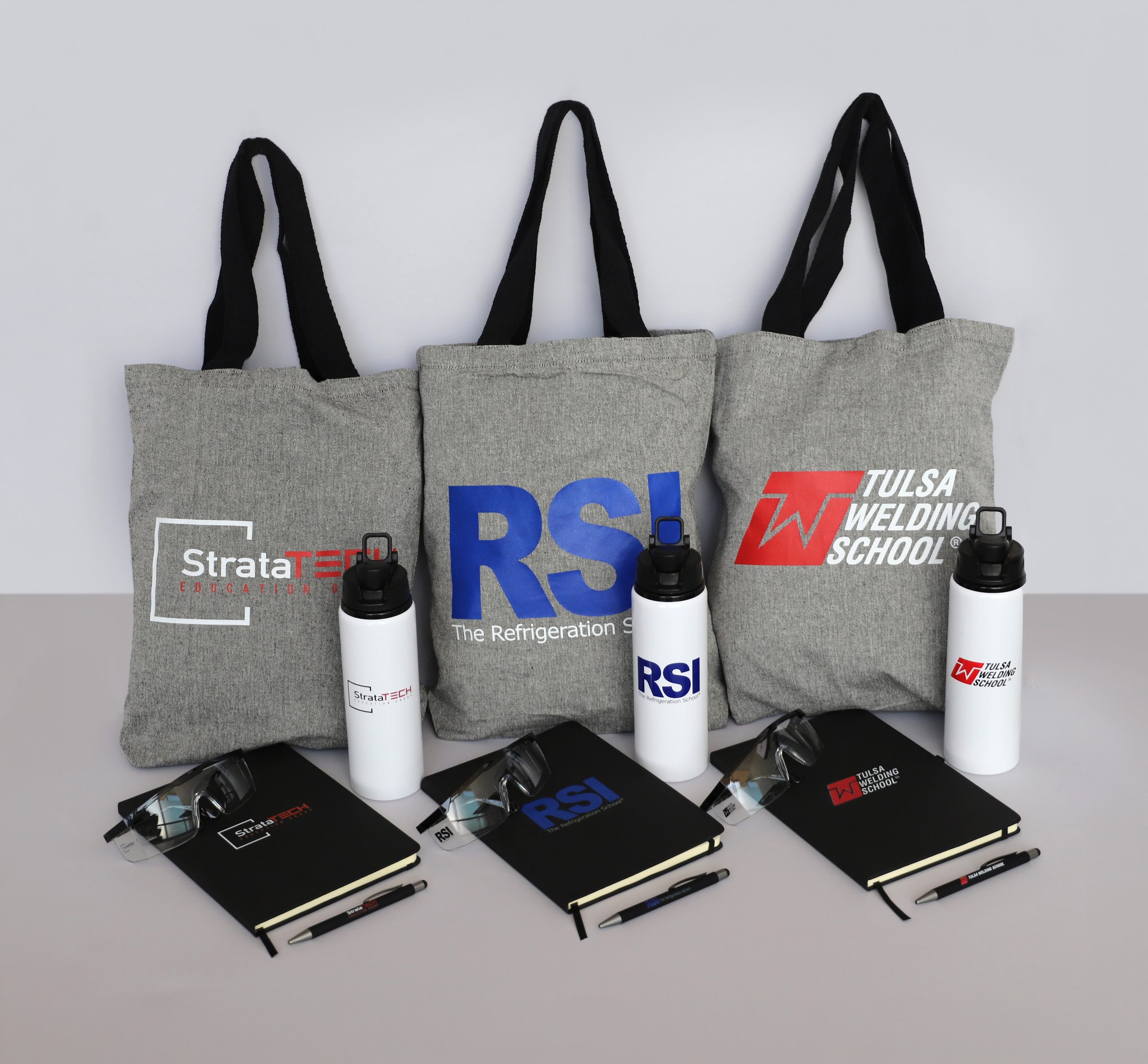 Branded bags, waterbottles, and notebooks for StrataTech, RSI, and Tulsa Welding School