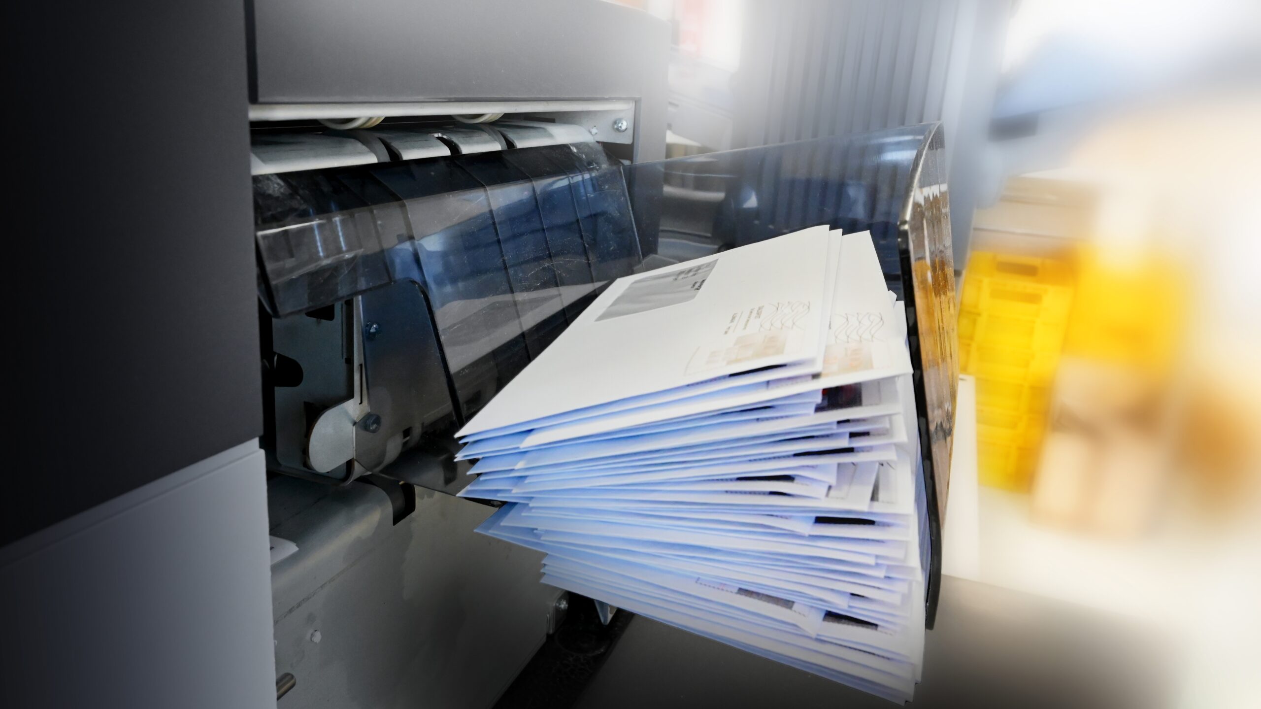 Enveloping machine in that is preparing envelopes to be shipped out and processed