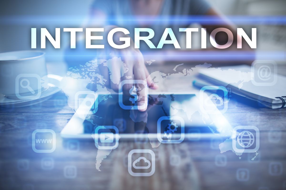 Digital illustration of "Integration" with tech icons over a person using a tablet.