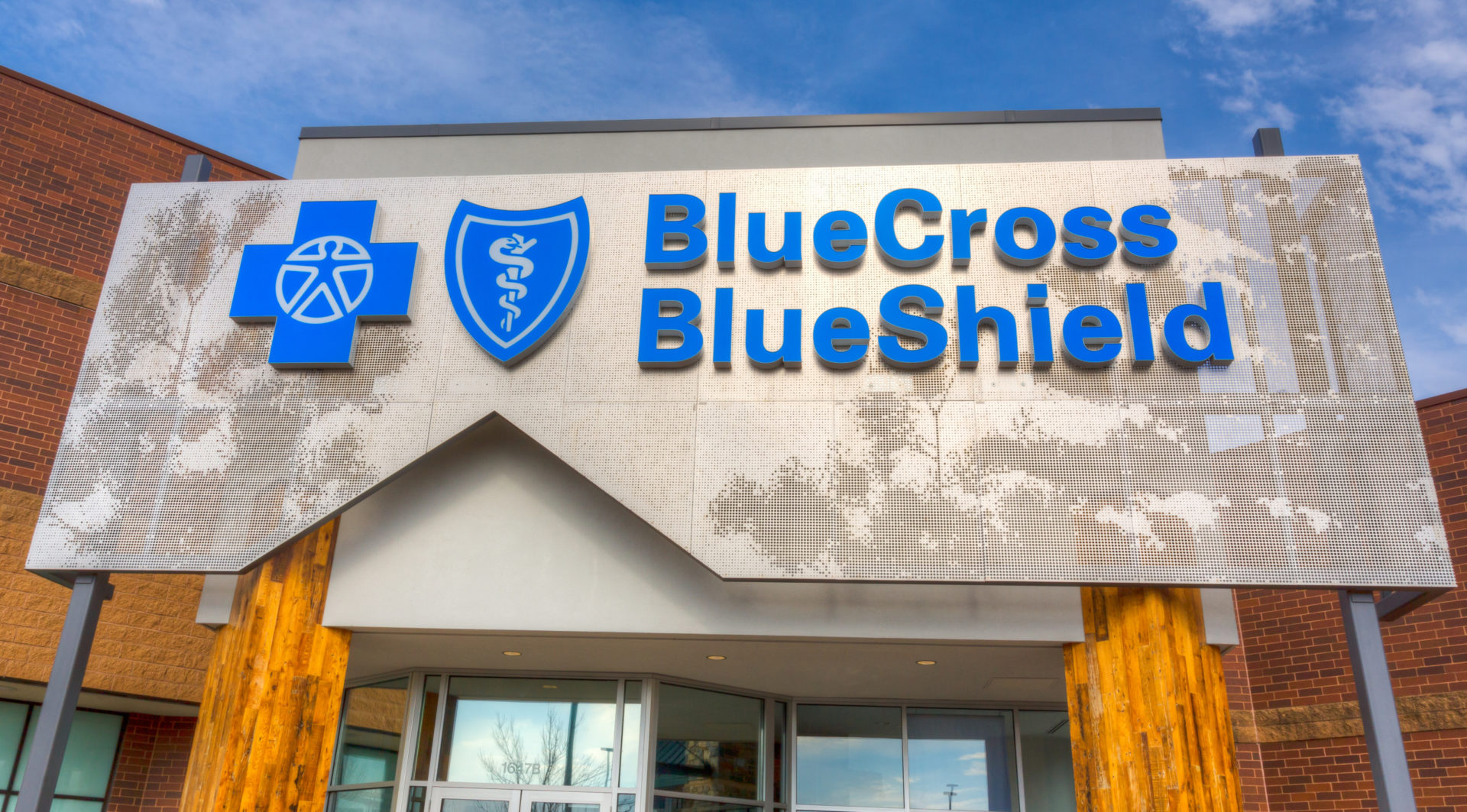 Blue Cross Blue Shield logo and signage on the exterior of an office building.