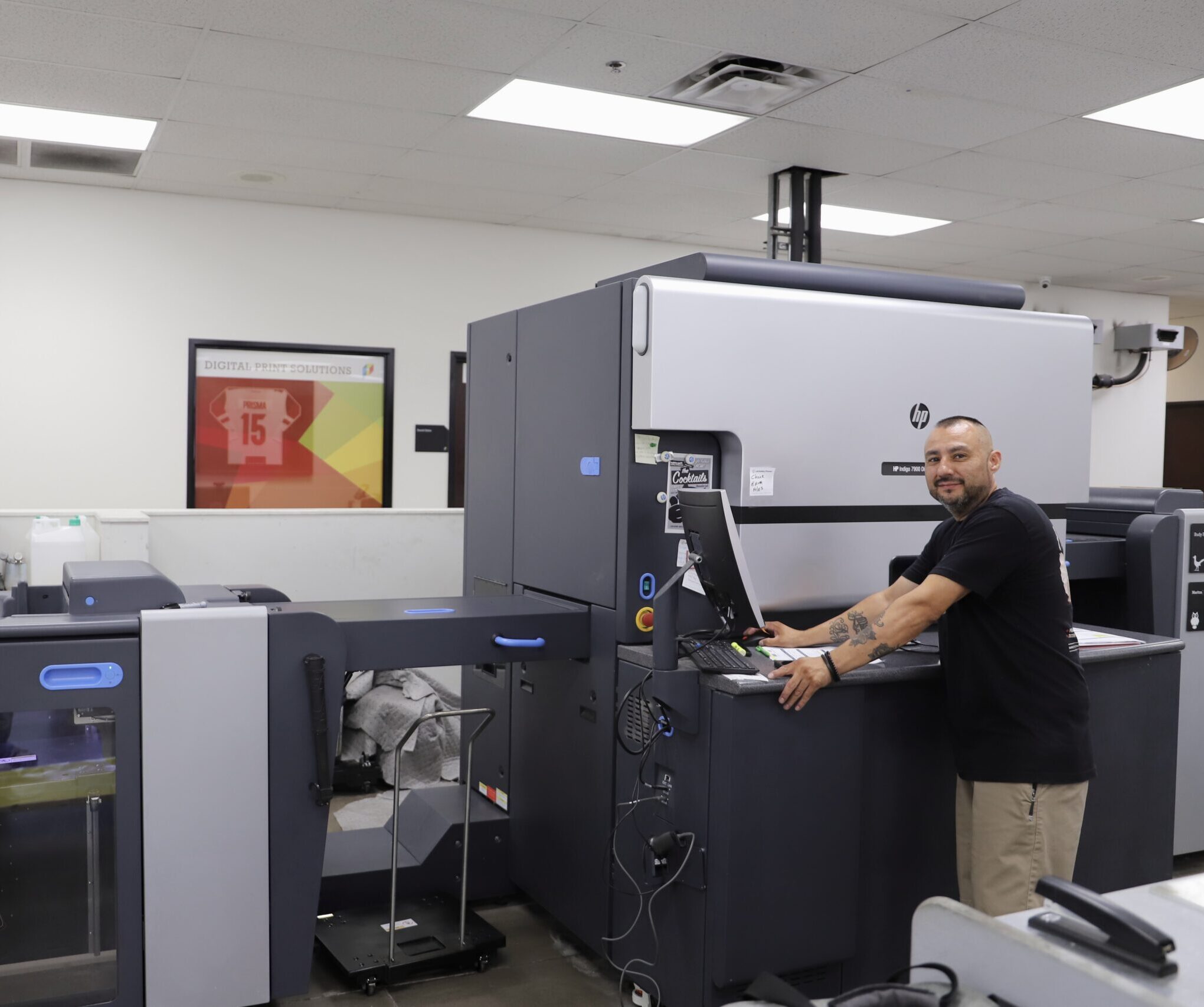 Employee working on Indigo Printer